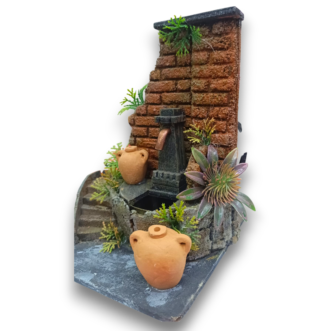 Fontana Nasone con parete in mattoncini rossi